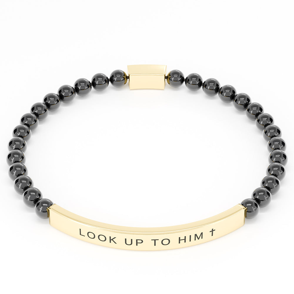 Look Up to Him cross bracelet in Black & Gold on white: black 4mm beads with a curved gold engraved bar