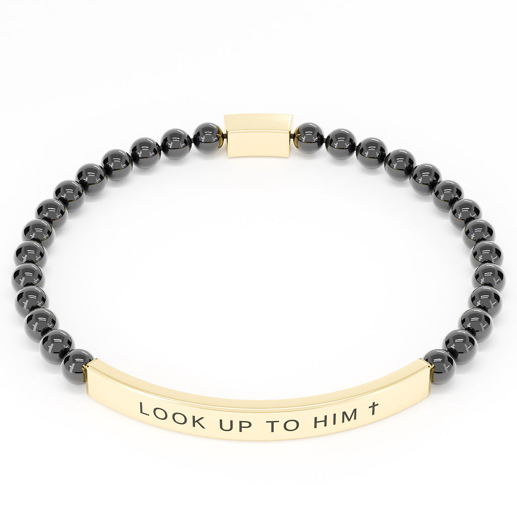 Look Up to Him cross bracelet in Black & Gold on white: black 4mm beads with a curved gold engraved bar