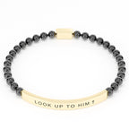 Look Up to Him cross bracelet in Black & Gold on white: black 4mm beads with a curved gold engraved bar