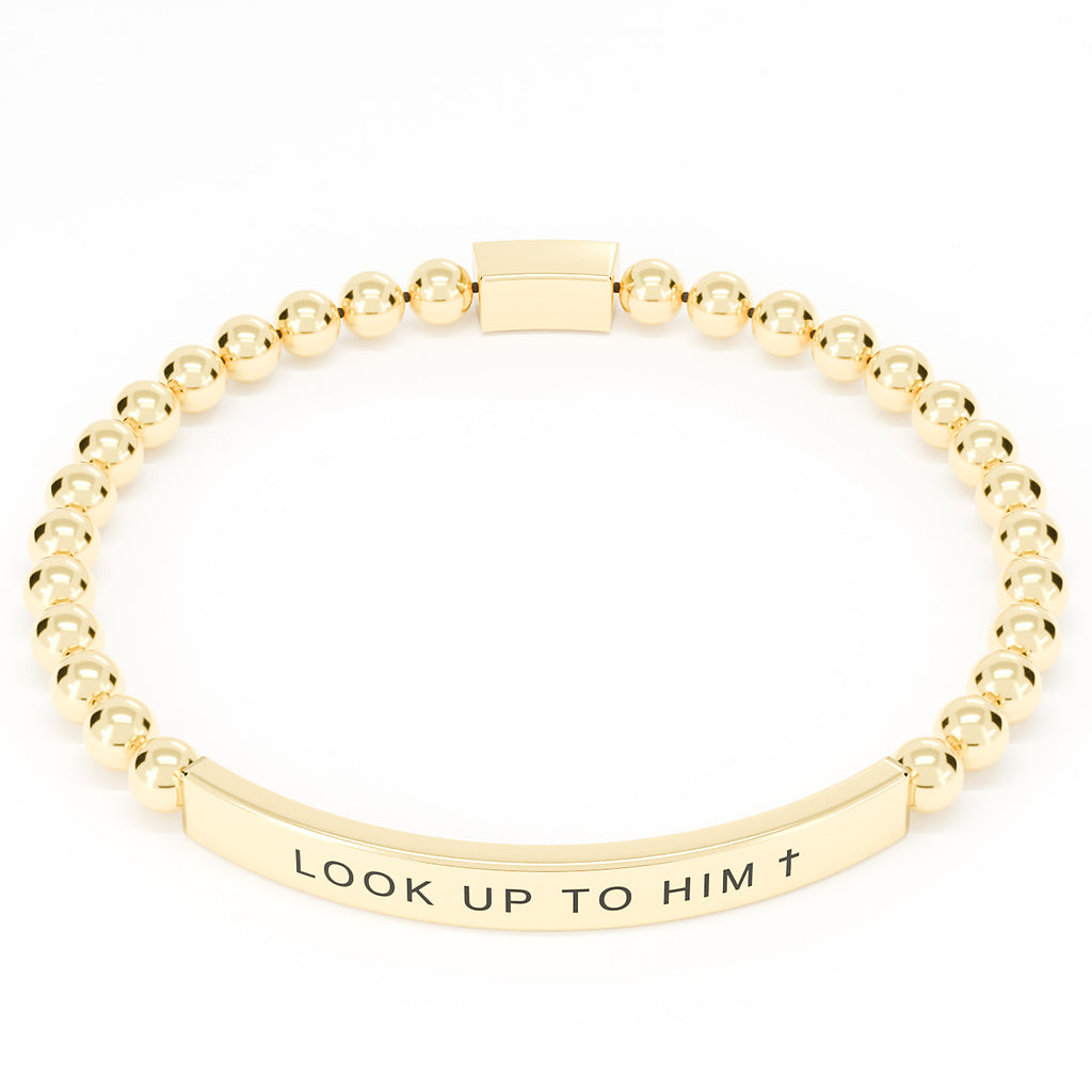 Look Up to Him cross bracelet in Gold on white: 18K gold PVD beads and engraved bar